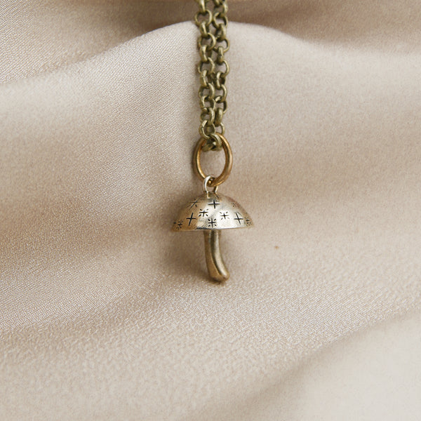 Cast brass mushroom pendant necklace from Cival Collective, a jewelry store in Milwaukee WI