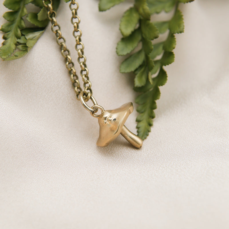 Cast brass mushroom pendant necklace pictured in Cival Collective, Milwaukee WI