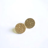 close up of leigh earrings, cast textured brass