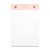 plain paper notepad with pink top and gold bolt clamps