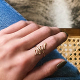 Bronze adjustable snake ring by Milwaukee WI Based Jewelry Designers Cival Collective. Handmade designs made in their studio boutique by local women artists. 