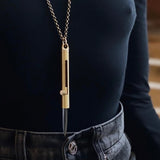 Secret stabber knife necklace pictured on a model at Cival Collective