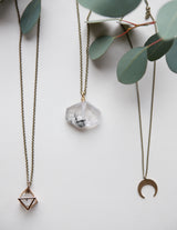 collection of brass moon and gemstone necklaces handmade by Midwest jewelry designers, Cival Collective.