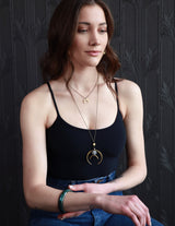 Model wearing handmade jewelry by designers Cival Collective.