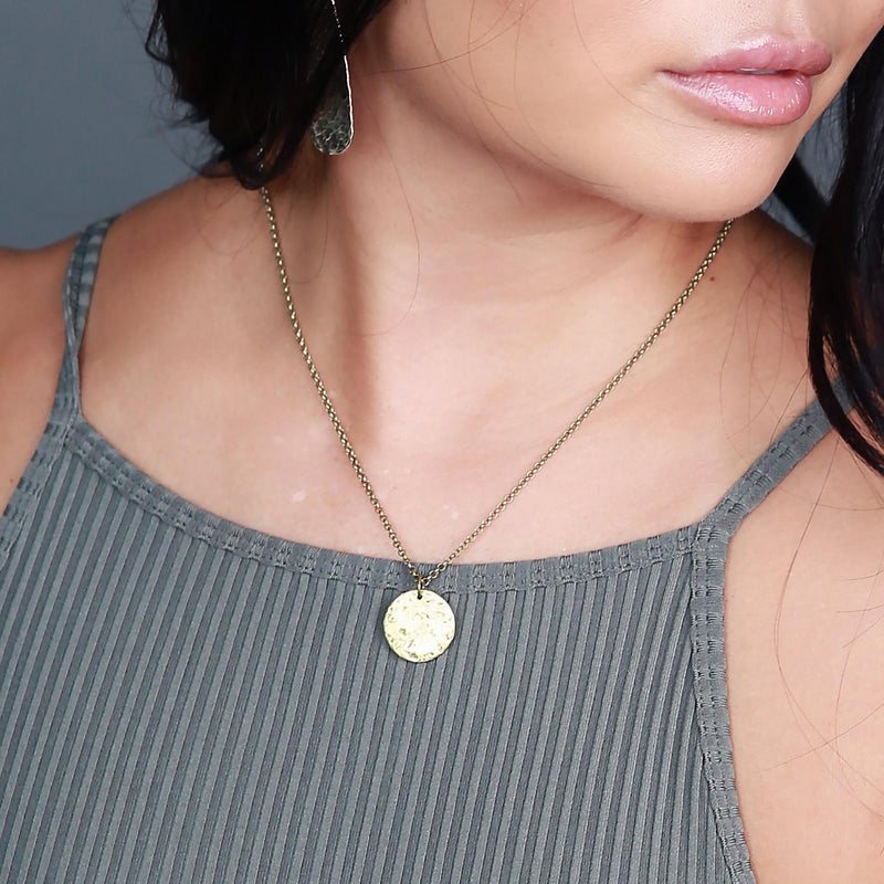 Delicate brass necklace handmade by jewelry designers, Cival Collective.