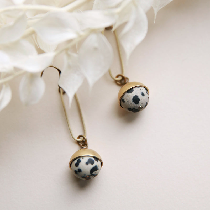 Dalmatian Jasper and brass earrings crafted by local Milwaukee Jewelry Designers, Cival Collective.