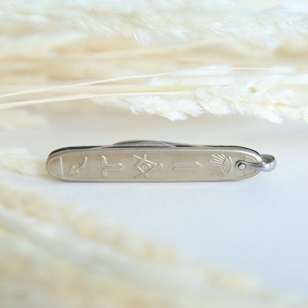 silver pocket knife with engraved masonry images 