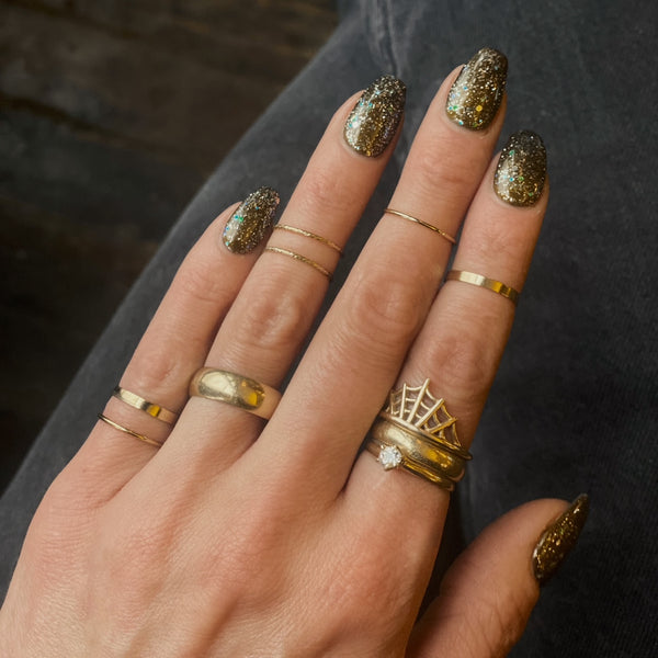 close up of gold fill midi ring on hand, available at cival collective 