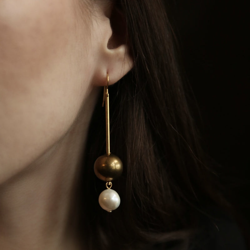 Large brass and pearl straight drop earrings.