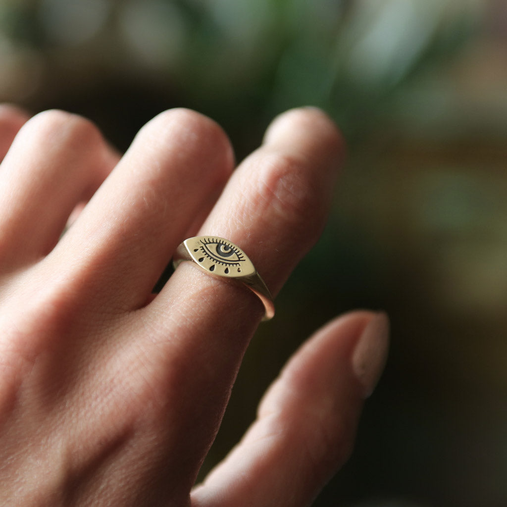 14k gold ring featuring an "Evil Eye" with a patina. Made by Cival Collective in Milwaukee, WI.