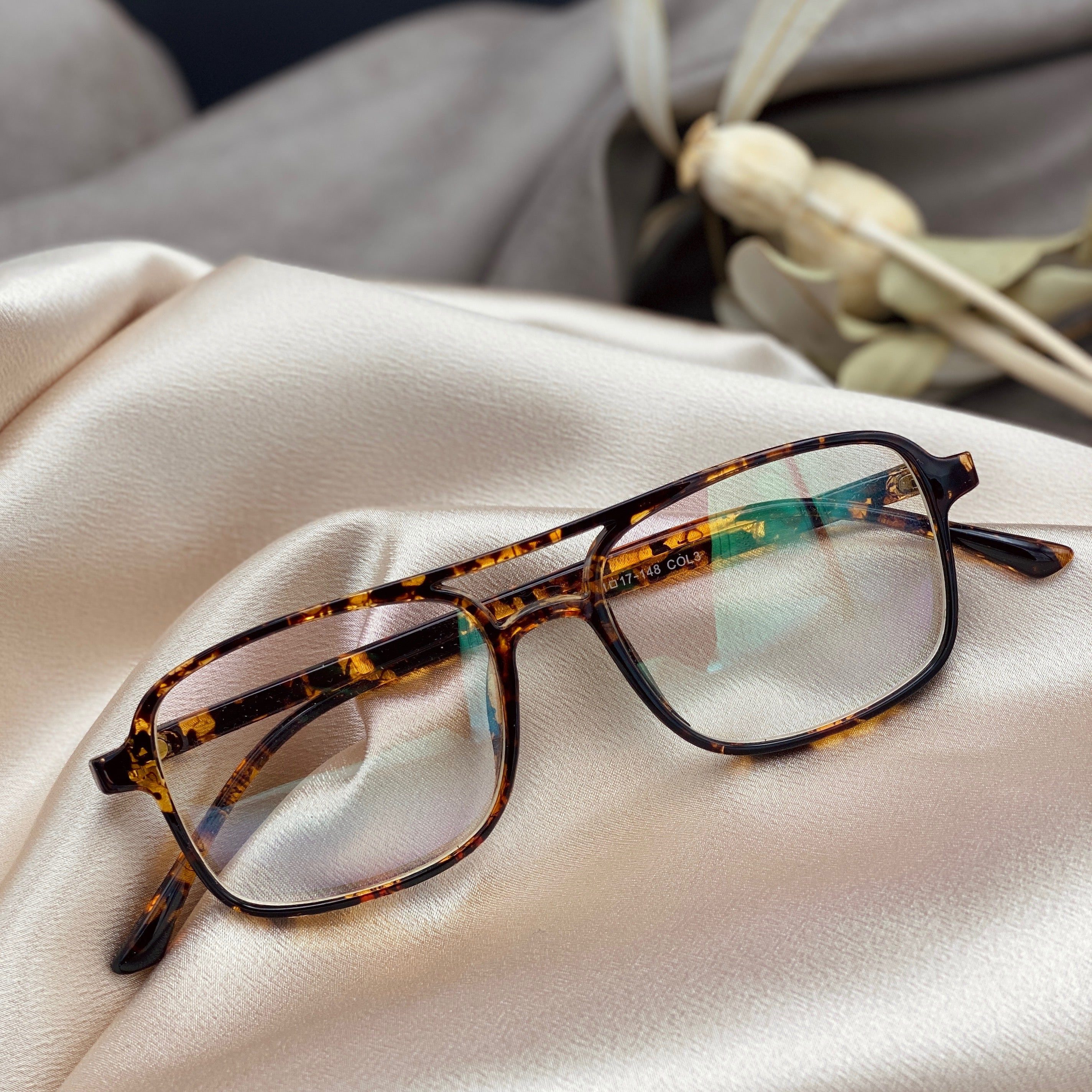 blue blocking lenses in a tortoise shell frame