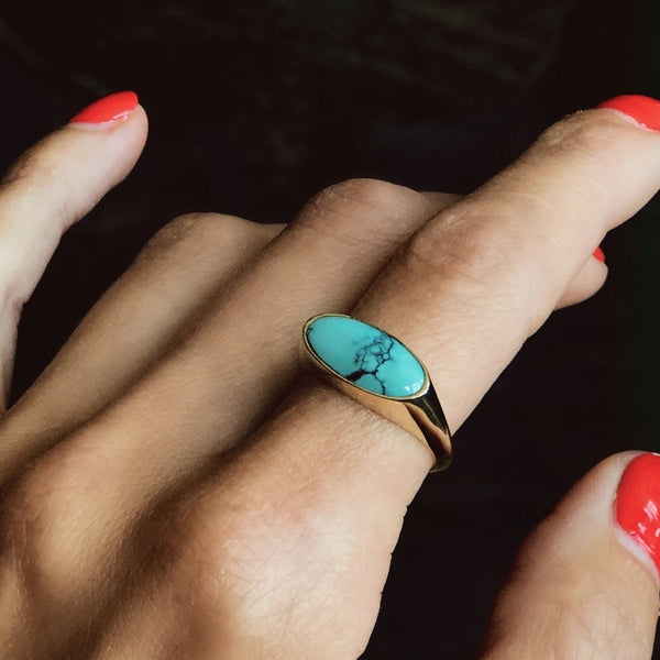 elongated oval signet style turquoise ring in brass or sterling setting 