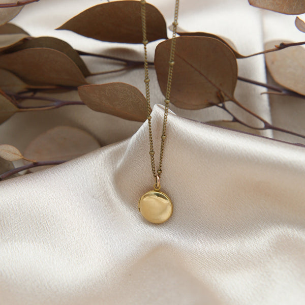 Mini round brass locket necklace from Cival Collective, Milwaukee. 