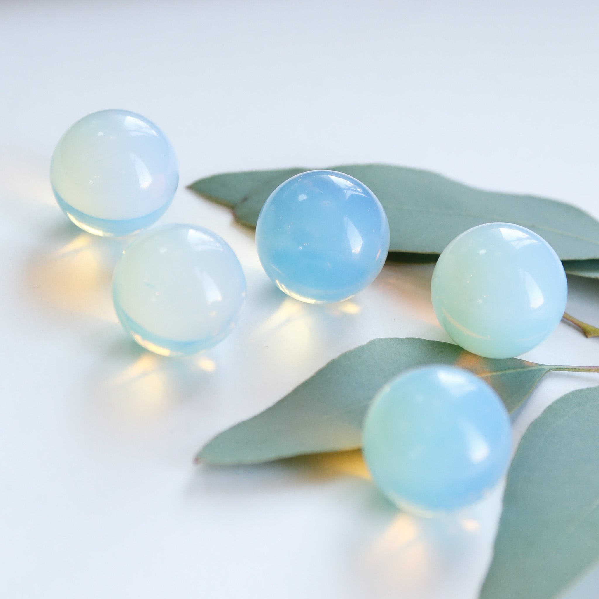 opalite spheres on white background