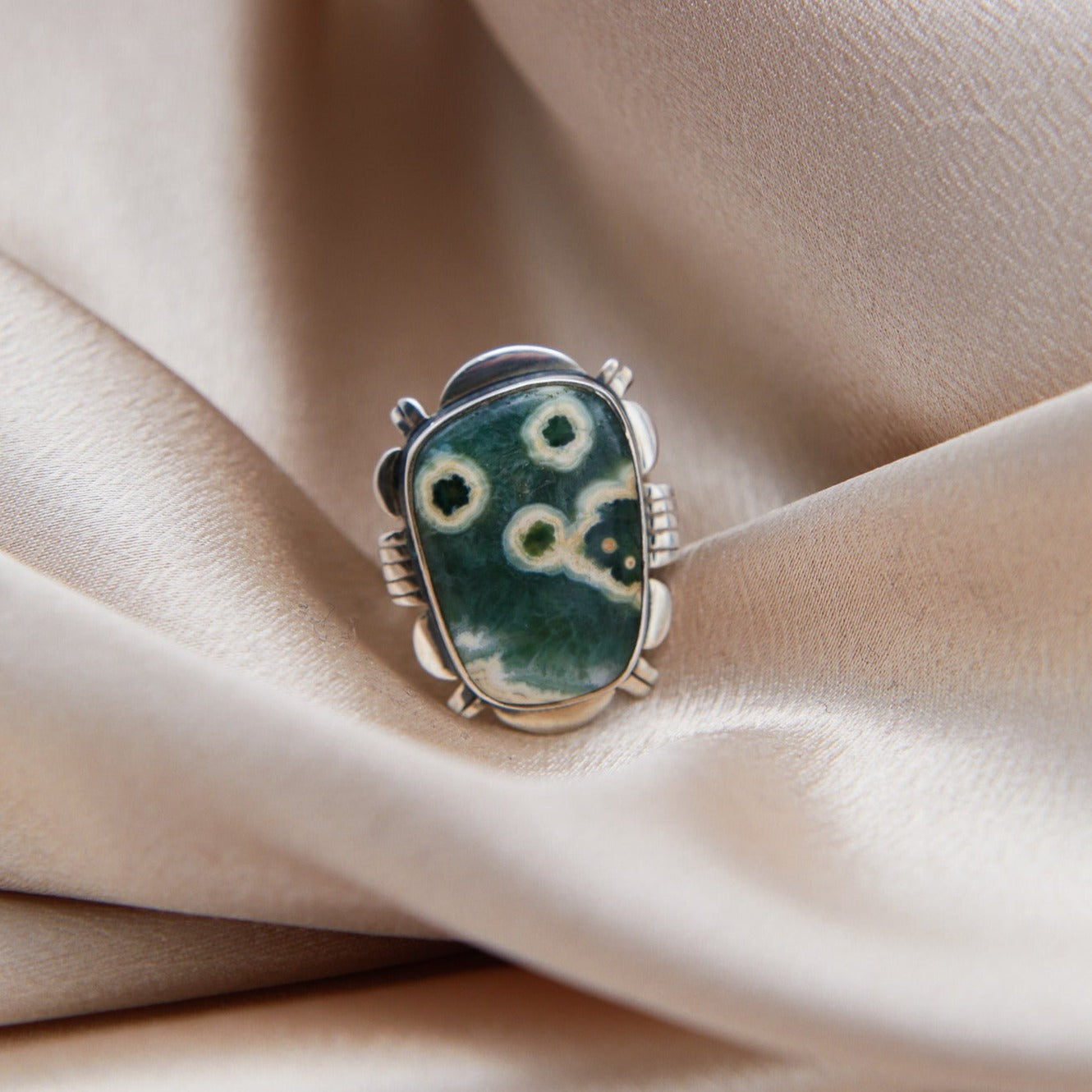 close up of freeform cut Ocean jasper ring, adjustable sterling silver band 