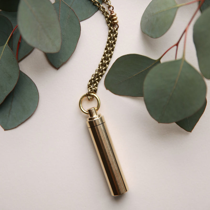 Brass canister necklace crafted by local Milwaukee Jewelry Designers, Cival Collective.