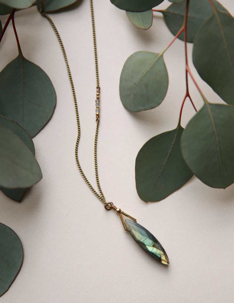 Stunning faceted labradorite pendant meticulously crafted with clean sophistication in mind by local Milwaukee jewelry designers, Cival Collective.