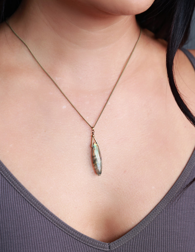 Stunning faceted labradorite pendant meticulously crafted with clean sophistication in mind by local Milwaukee jewelry designers, Cival Collective.