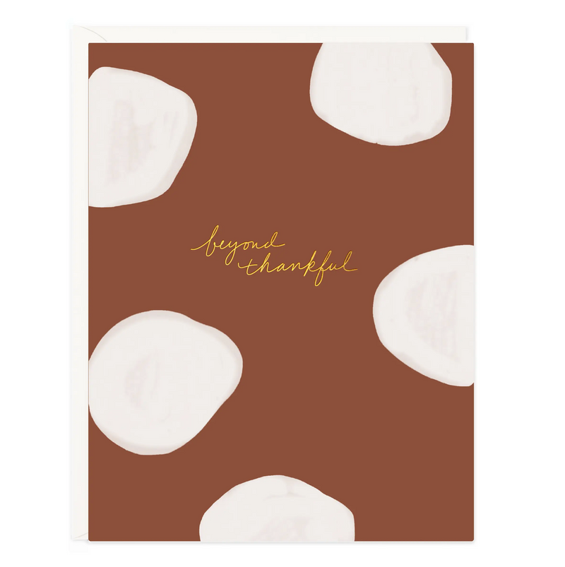 brick colored card with white painted dots and gold foil lettering reading "beyond thankful" Boxed set of 6 Blank Inside Envelope Color: Pure White Size: A2 Folded 4.25” X 5.5” Paper: Crisp White Heavyweight Paper Printing Type: digital with gold foil