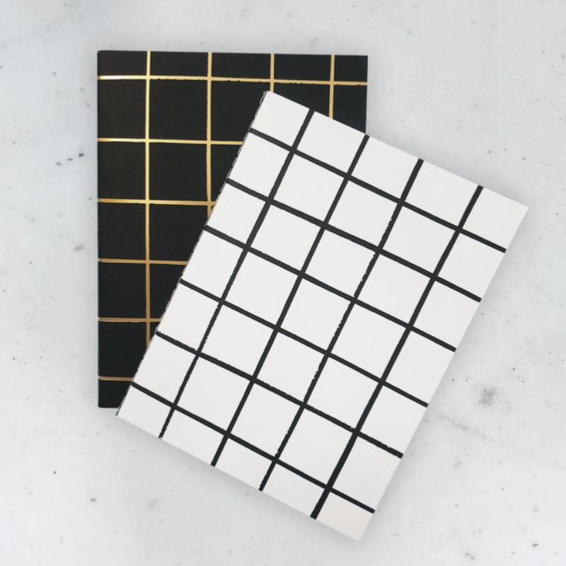 Pocket book letters with black, white, and gold grid covers 