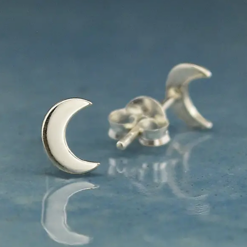 close up of silver crescent moon post earrings