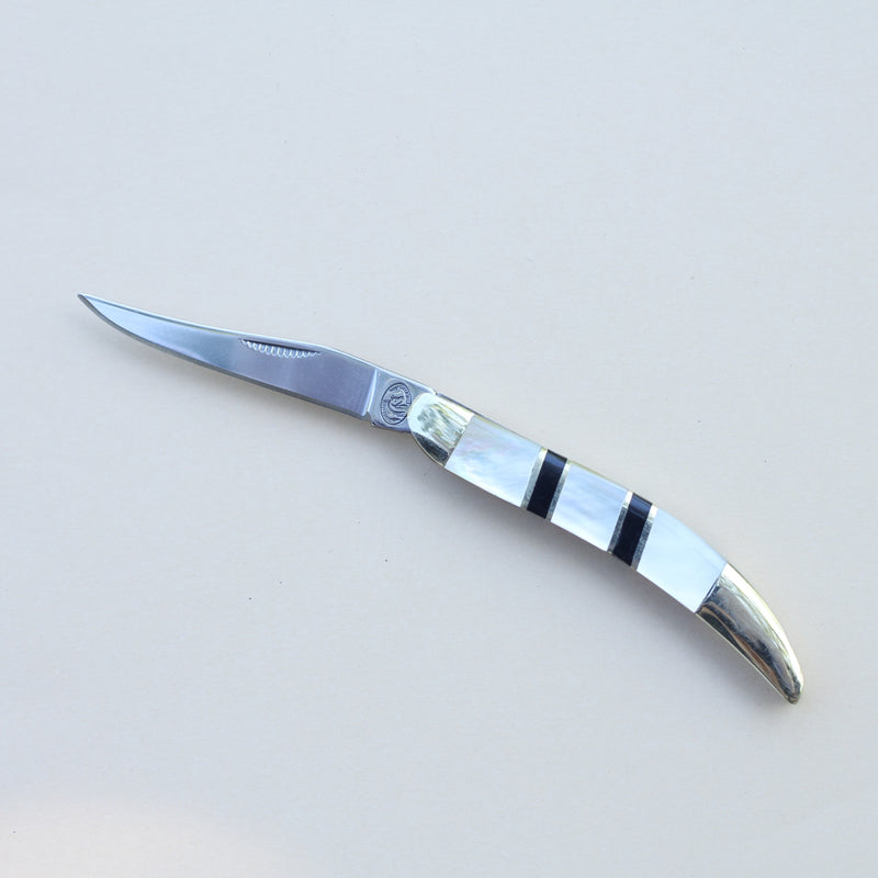 Open toothpick stainless steel pocket knife with mother of pearl and onyx inlay handle. 5 inches long with brass bolsters.