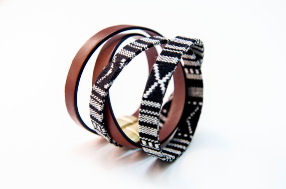 CIVAL's "Acer" bracelets shown in tan Italian leather and black & white "IKAT" fabric, both 10mm wide and double wrapped and closed with magnetic clasp. 