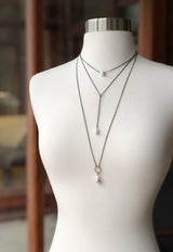 Cival Jewelry designs bridal collection featuring natural pearls and antique brass chain.