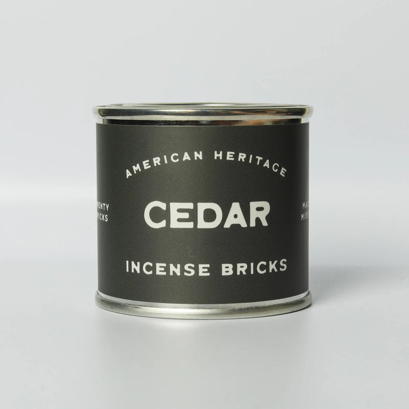 image of tin container incense brick on white background. tin labeled "american heritage cedar incense bricks"
