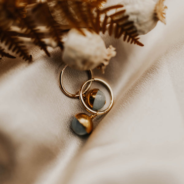 Close up of brass capped stones on gold fill hoops