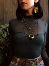 Three necklace layering set including two Dalmatian jasper necklaces & a brass sphere suspension necklace. Pictured on model from CIVAL Collective in Milwaukee WI. Also on model are the brass Dana earrings.
