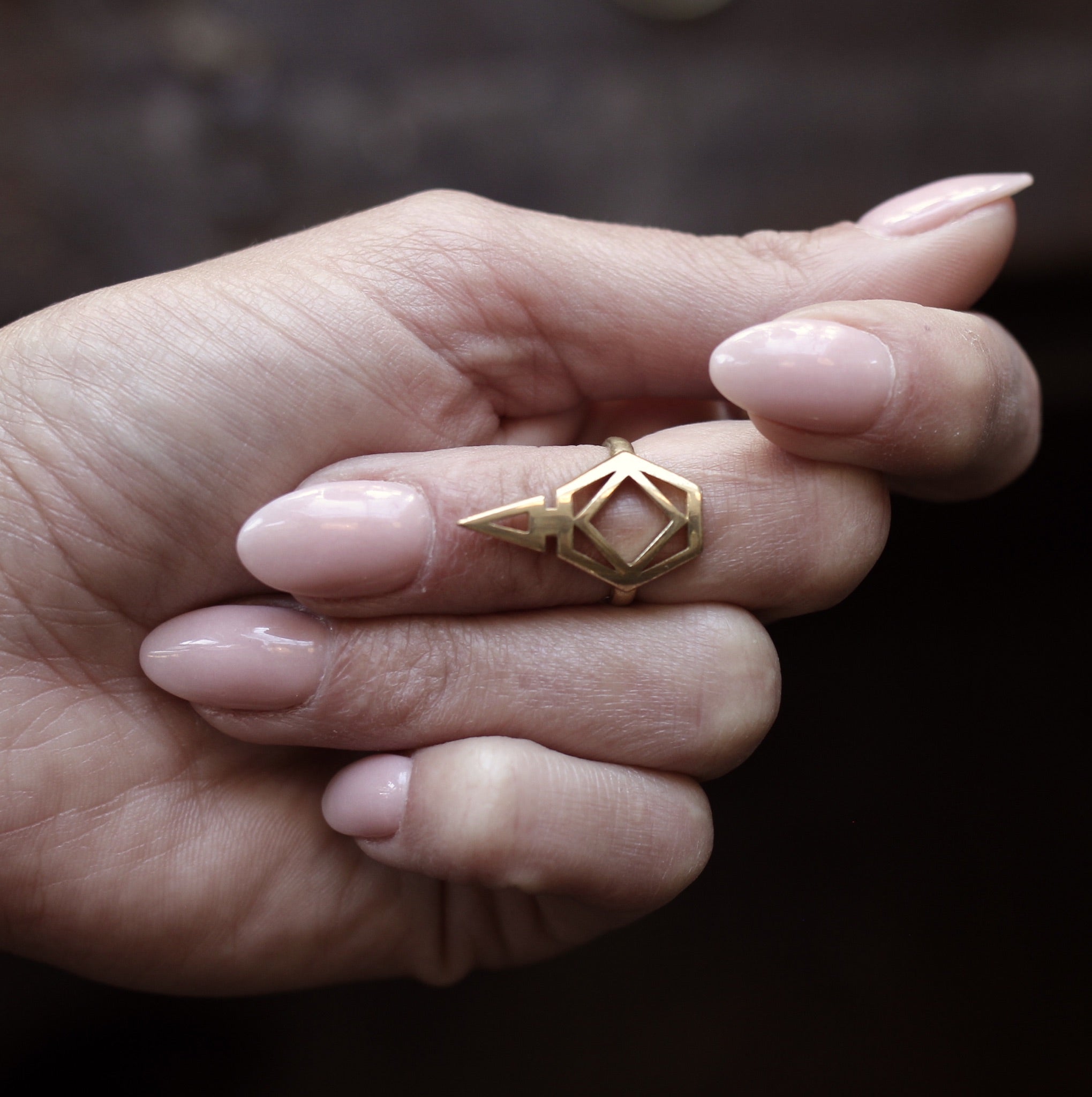 close up of Nina midi ring on model 